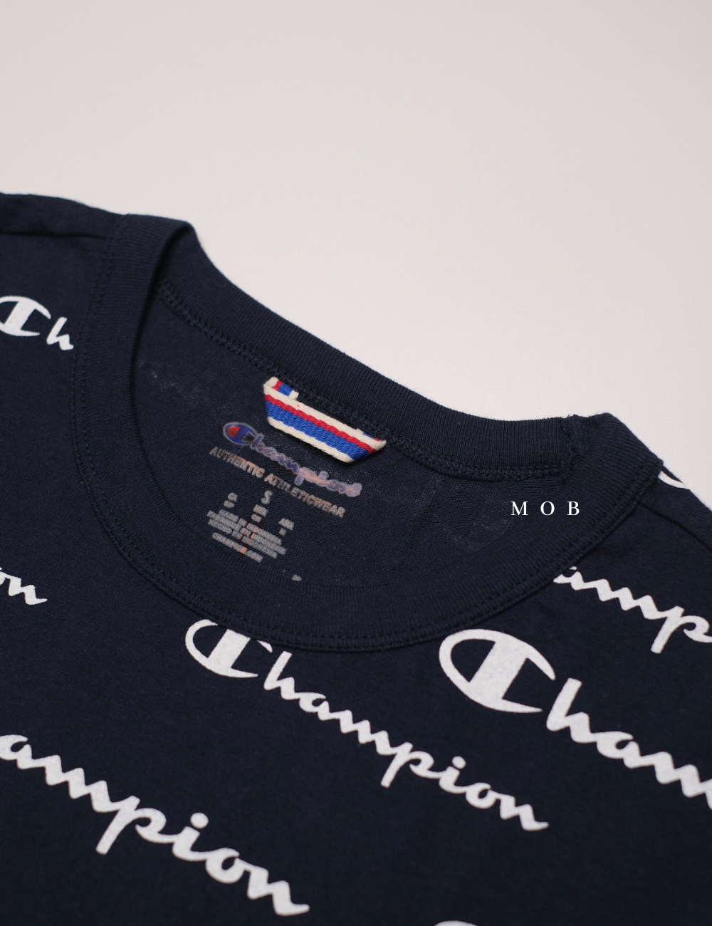 CHMPSST1603 All Over Repeating Logo Tee Navy (S ONLY)