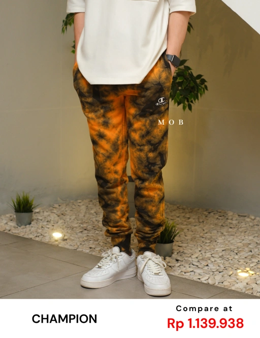 Image of CHMPJP09001F Galaxy Tie Dye Jogger Orange Black