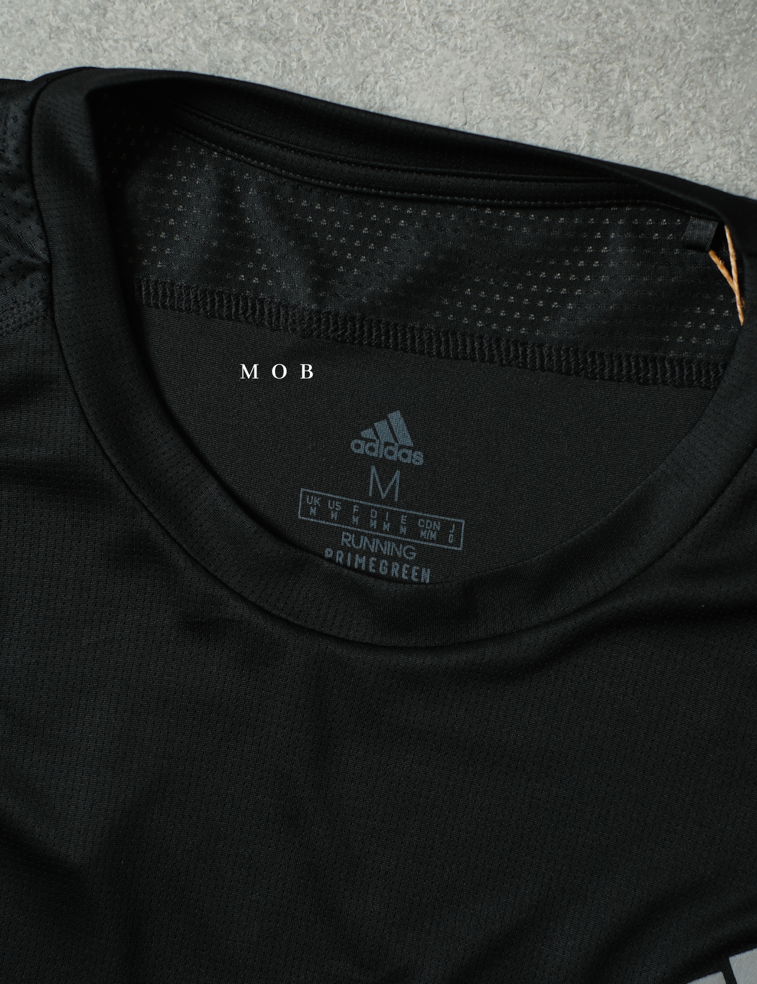 ADDSSST07004B Own The Run SS Tee SIDE Aeroready Black (M ONLY)
